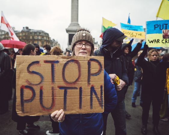 London, England, United Kingdom - March 5 2022: Woman with “Stop Putin” Sign in Trafalgar Square