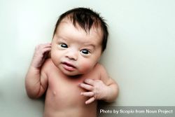 Portrait of newborn baby on light textile 0PWQvb