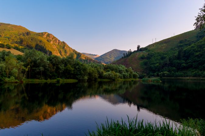 Wonderful lake between forest and hills