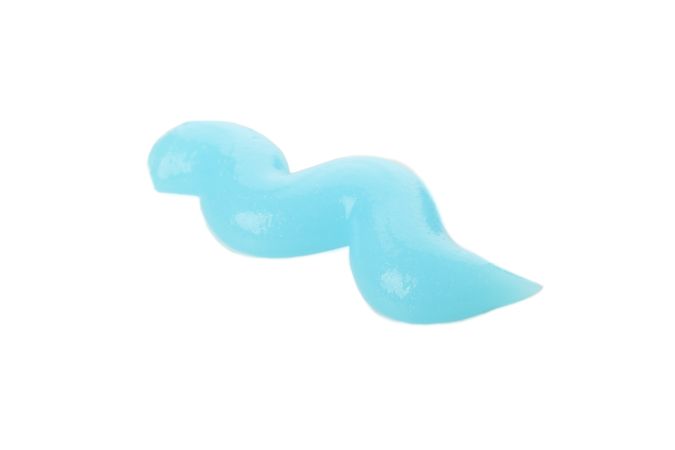 Blue squeezed toothpaste isolated on light background