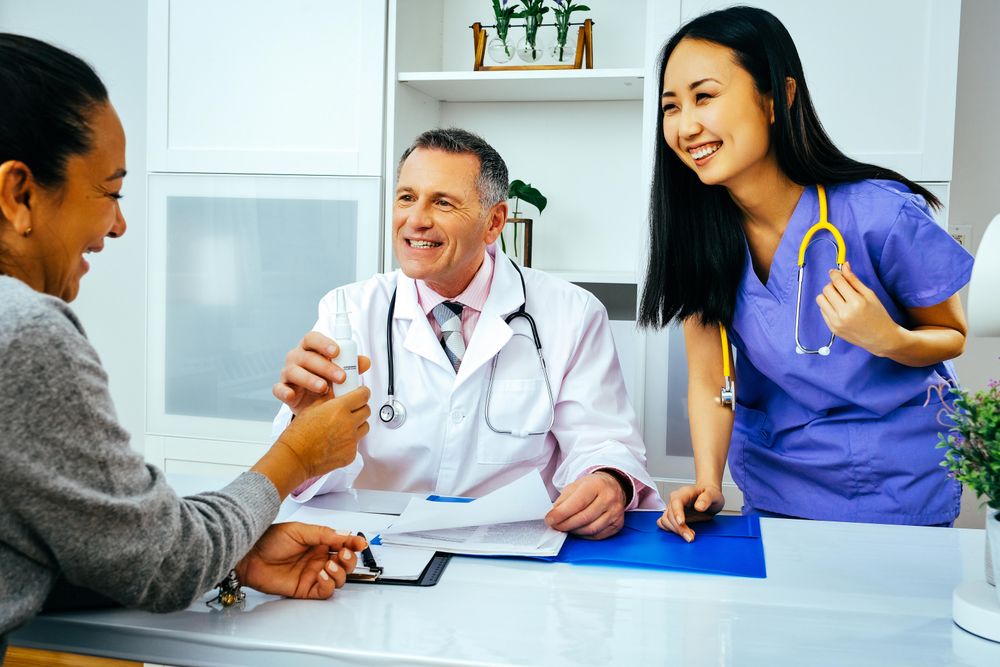 Happy female patient receiving medication for a cold in clinic