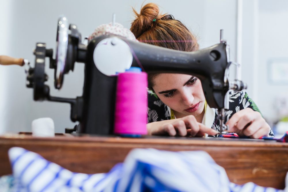 Woman in a sewing school