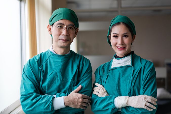 Portrait of male and female surgery in hospital scrubs