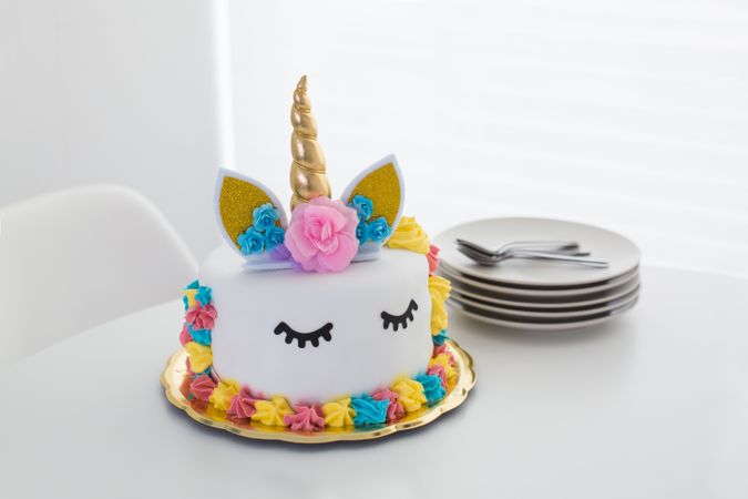 Cute unicorn cake with painted closed eyes