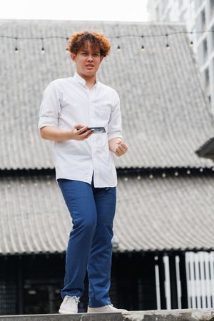 Asian man with mobile phone