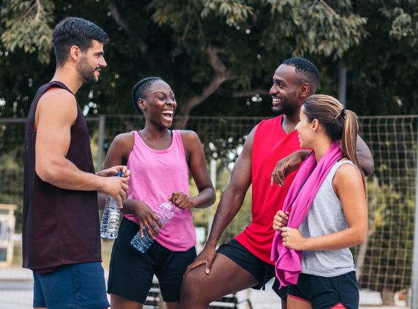 Team Spirit: Multiracial Friends Chatting and Bonding After a Fun Basketball Game