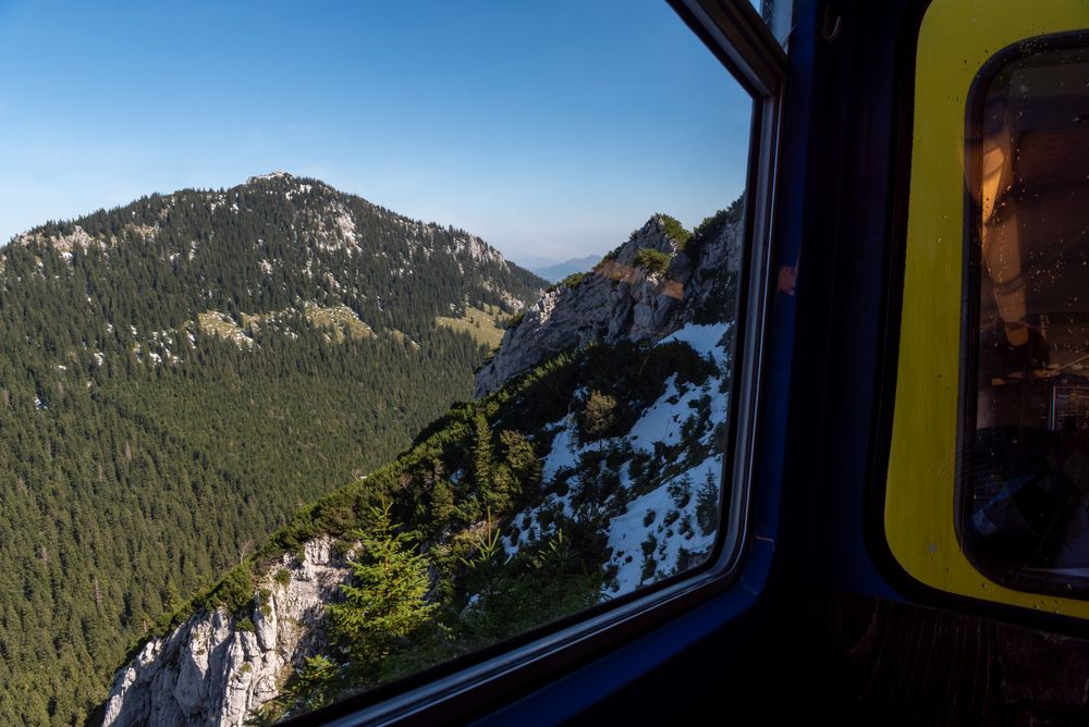 Cog railway window view in the Bavarian Alps on a sunny day in September