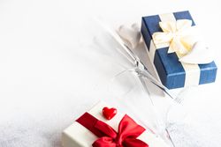 Valentine Day holiday card concept with table setting with hearts and red glitter