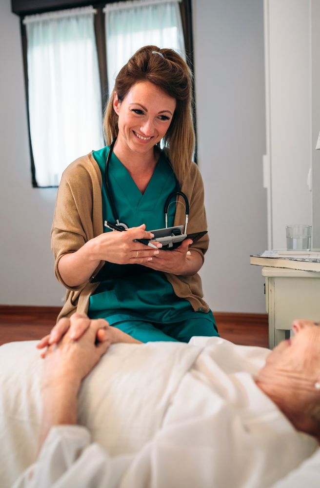 Female doctor comforting older patient