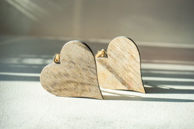 Valentine's day concept of two wooden heart ornaments 
