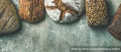 Healthy homemade bread loaves against grey background 5zNjP5