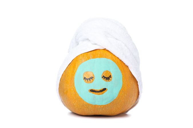 Pumpkin with facial mask and towel