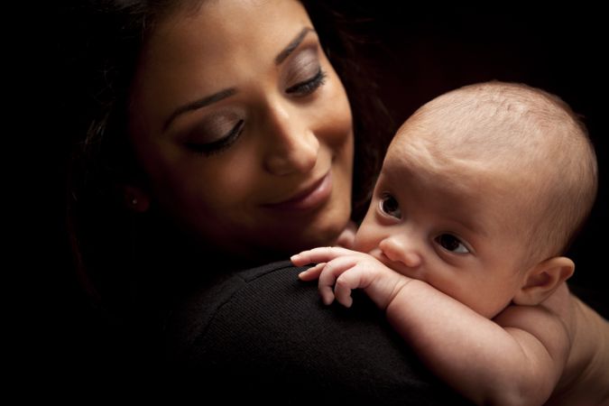 Attractive Woman with Her Newborn Baby
