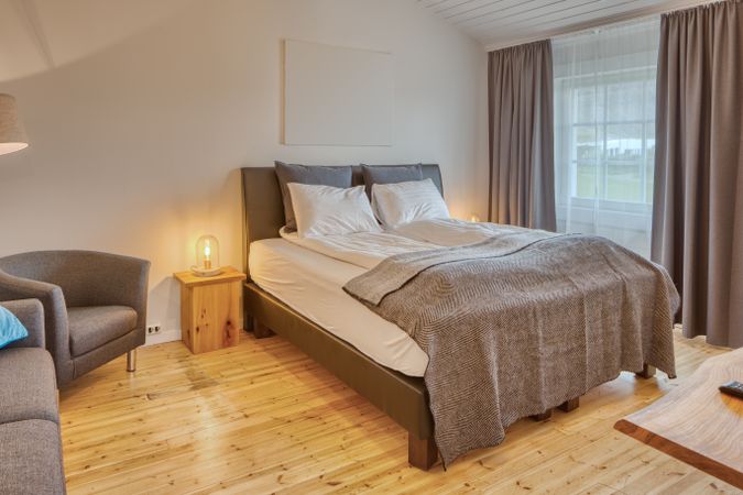 Cozy interior of bedroom with sofa