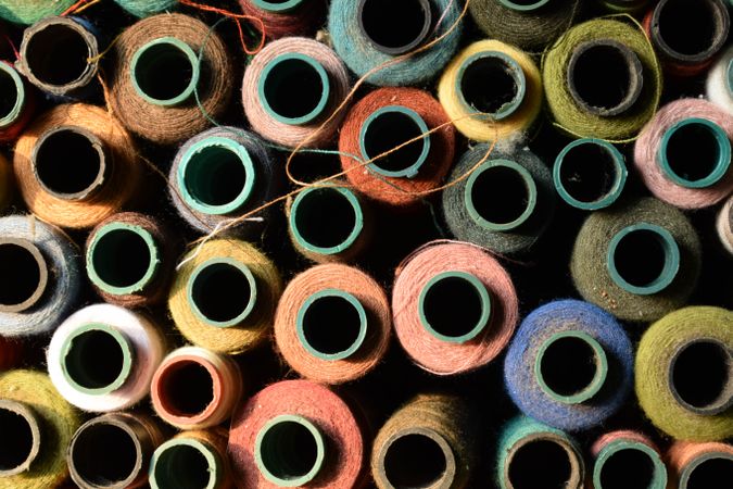 Pile of colorful spools for sewing machine