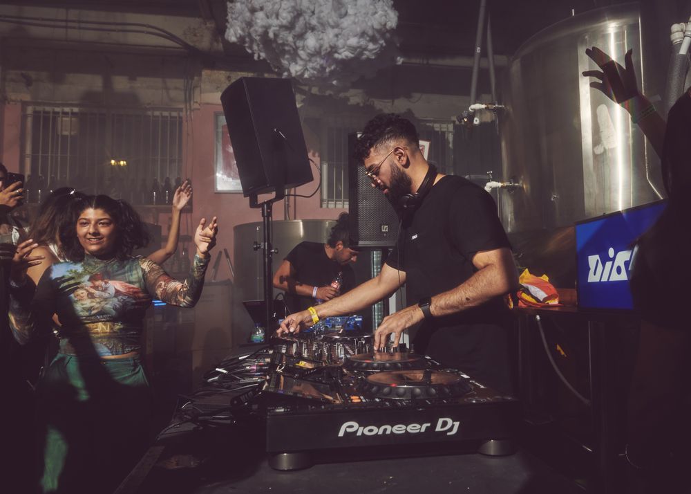 London, England, United Kingdom - Nov 9, 2022: Dj spinning at event in brewery