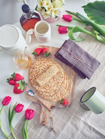 Delicious tasty homemade crepes on kitchen desk