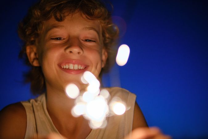 Smiling boy looking at Bengal lights
