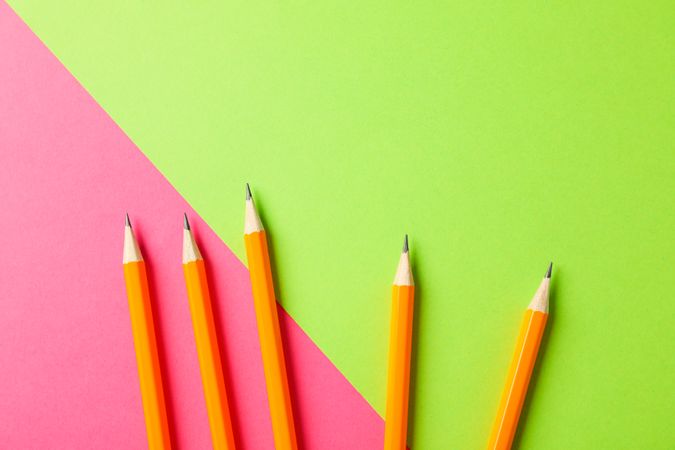 Pencils on two tone background, space for text