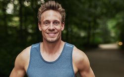 Man smiling while wearing sportswear
