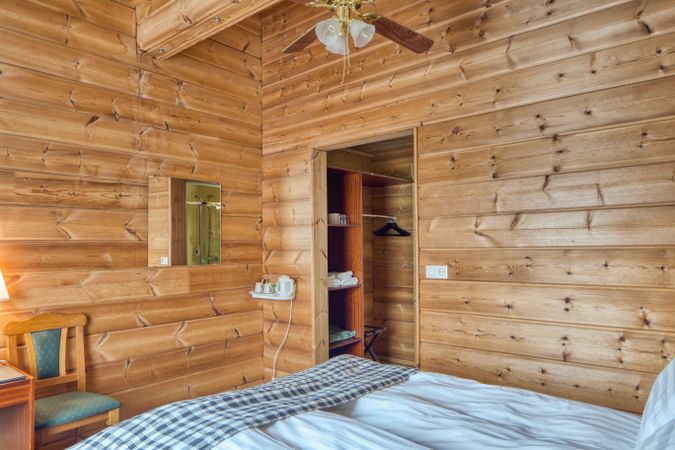 Comfortable hotel interior with wooden wall
