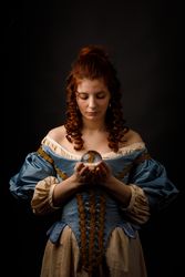 Baroque woman with glass ball