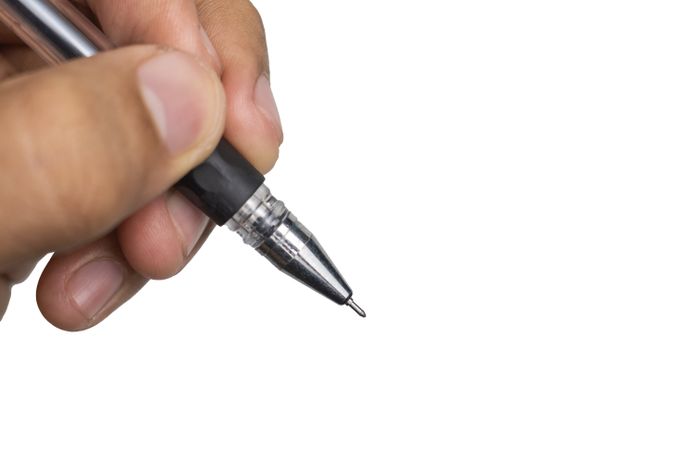 close up of male hand holding ballpoint
