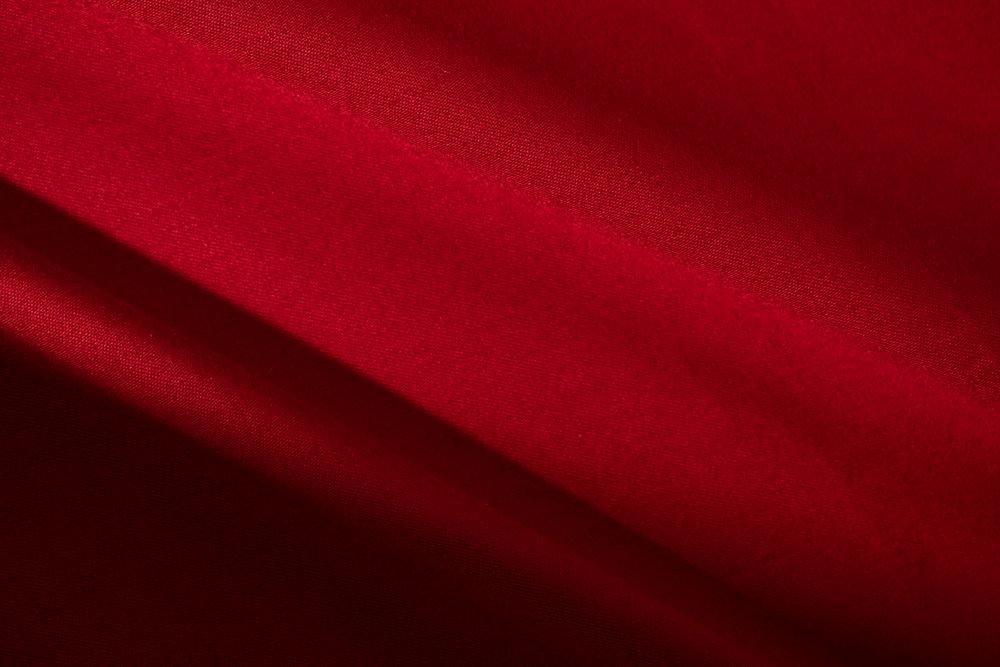 Diagonal Wavy Red fabric background texture.