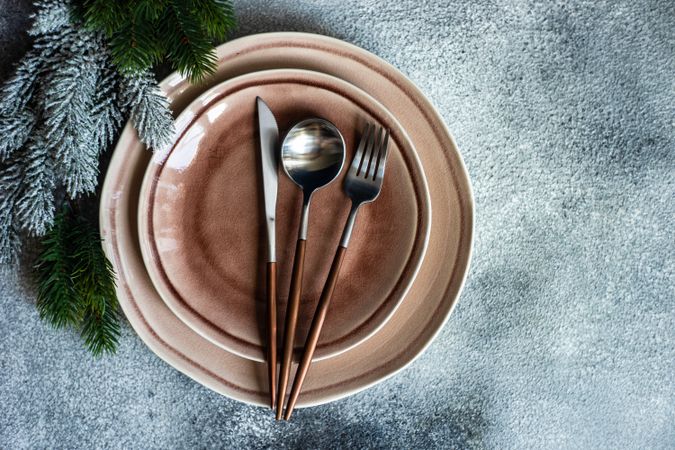Top view of Christmas table setting with pine branch