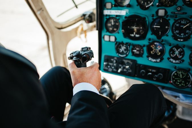 Pilot holding controller flying an airplane