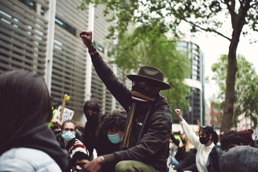 London, England, United Kingdom - June 6th, 2020: Group of people at BLM protest with raised fist