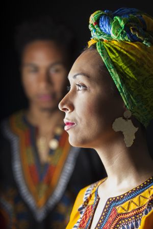 Couple of young people standing embracing