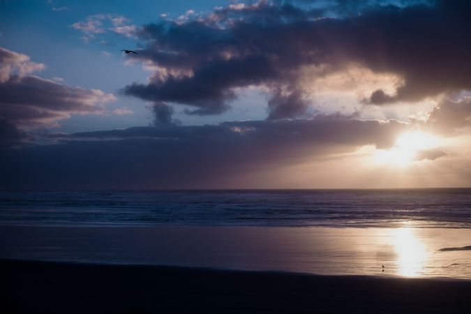 Beautiful sunset over sea with cloudy sky