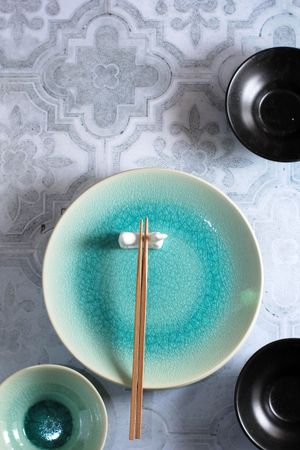 Food Props Top View Green Plate with Wooden Chopstick on Top. Typically Plate