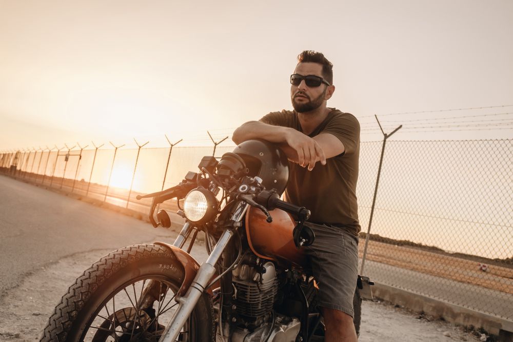 Strong man driving motorcycle
