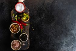 Wooden board with seasoning and spices