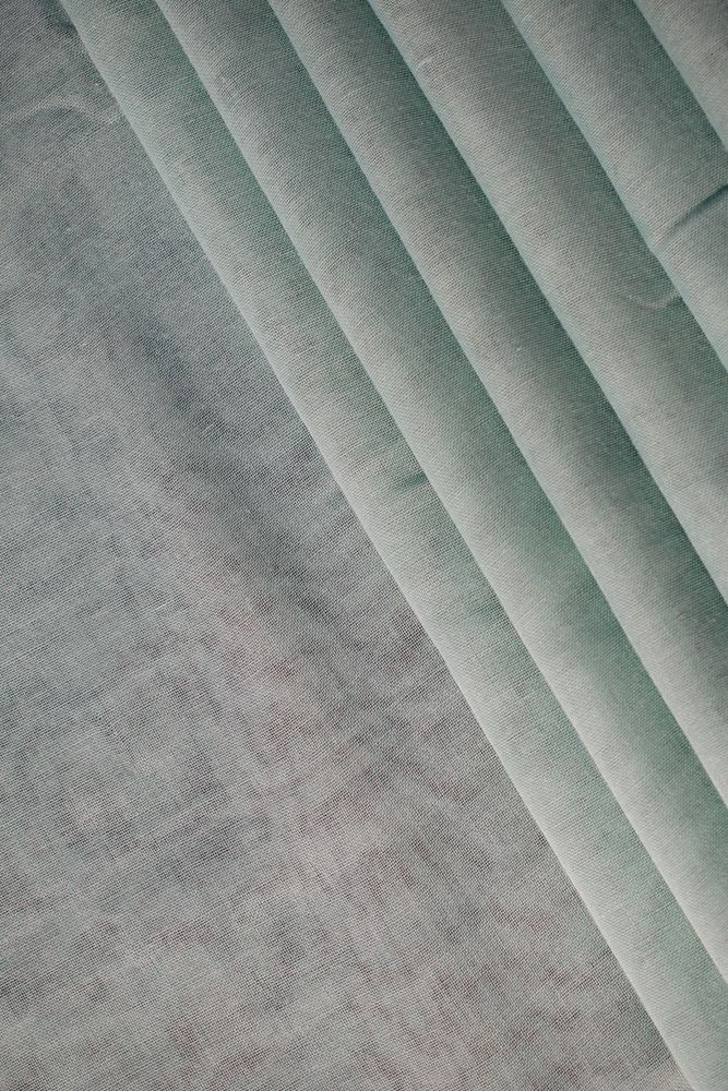 Nude green fabric folded background texture