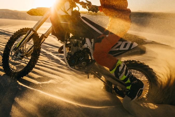 Dirt biker practicing in desert