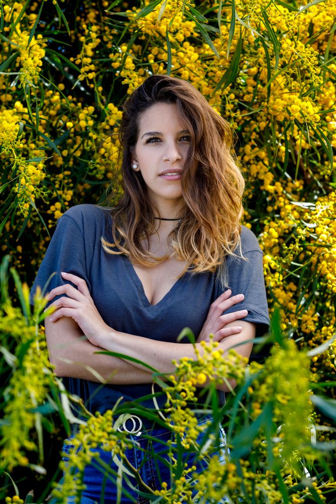 Young female near blooming bushes