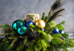 Christmas festive centerpiece with candle and pine arrangement
