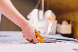 Crop hand cutting fabric