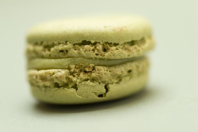 Close up of single pistachio macaroon