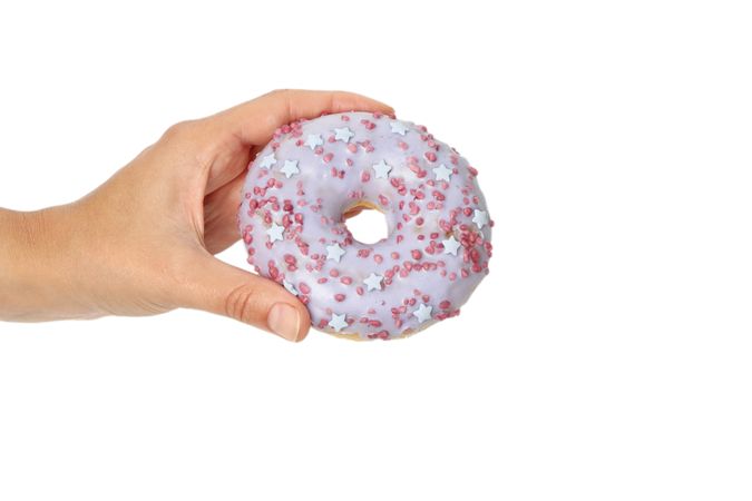 Female hand hold donut, isolated on plain background