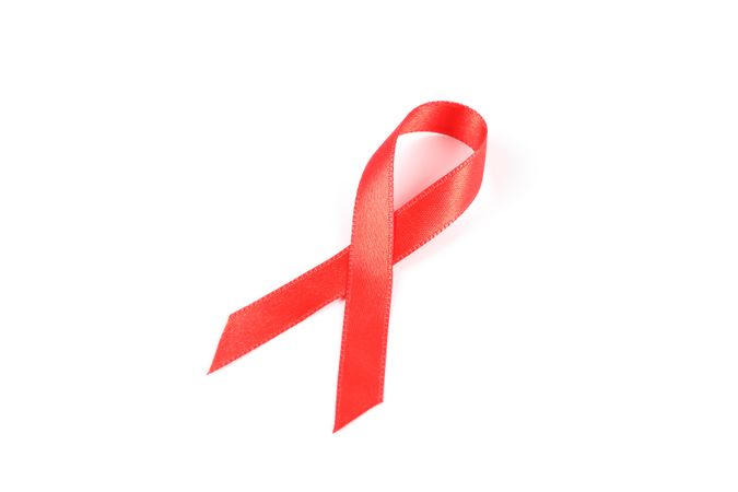 Red awareness ribbon isolated on blank background