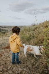Girl and dog out for a walk on an overcast day
