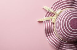 Pink sun hat on pink background