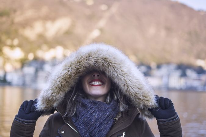 woman covering eyes with a hood