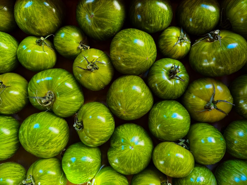 Green tomatoes at produce market