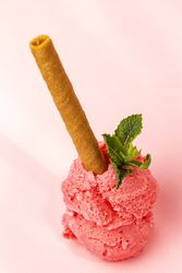 Strawberry ice cream scoops with waffle stick