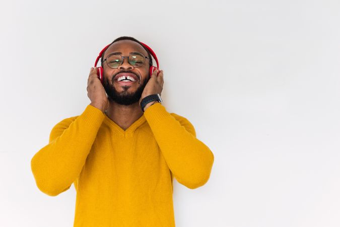 Black man listening to music in headphones